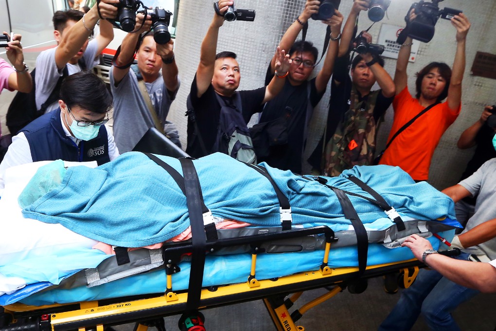 A woman who suffered burns in a dust explosion in Taiwan arrives at Queen Mary Hospital. Photo: Sam Tsang