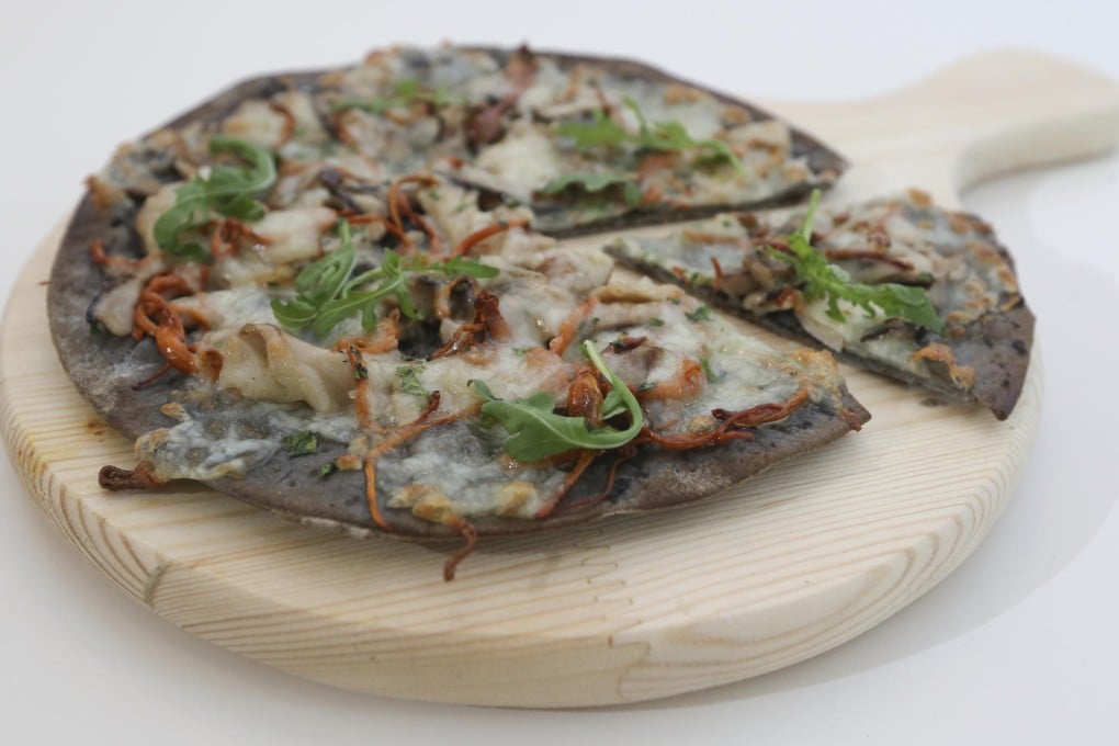 Black truffle porcini mushroom with cordyceps flower pizza at Kettle Black.