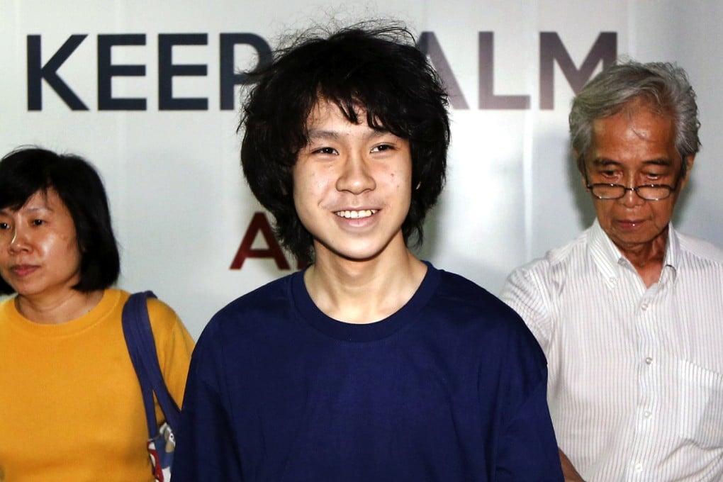 Amos Yee leaves the State Courts with his mother after his trial in Singapore on May 12, 2015. Amos Yee has been remanded in a mental institution. Photo: Reuters
