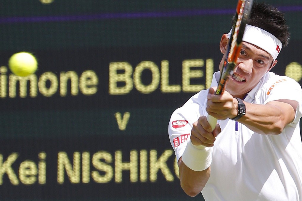 Kei Nishikori returns to Simone Bolelli. Photo: Kyodo