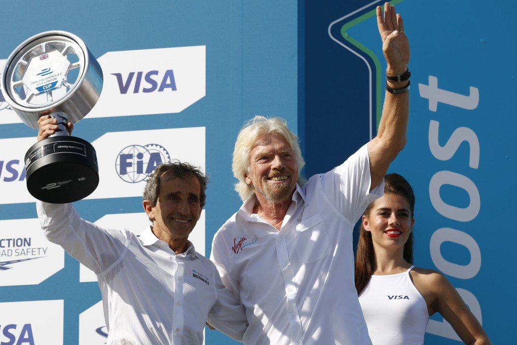 Richard Branson after presenting former French Formula One driver Alain Prost with the team trophy after the finale of the Formula E series in London. Photo: AFP