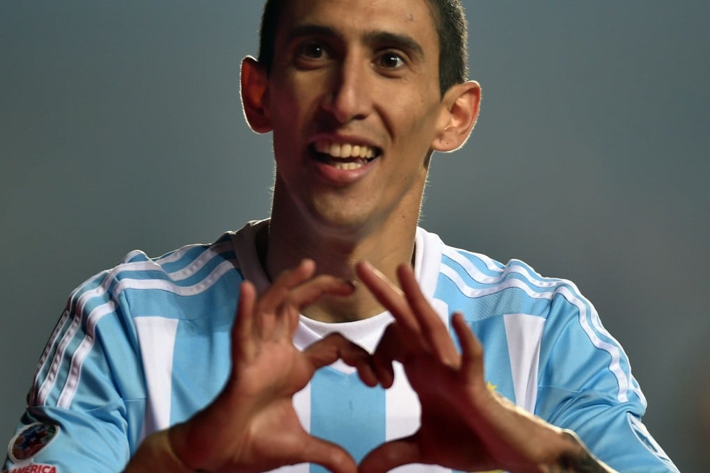 Angel di Maria celebrates one of his two goals against Chile. Photo: AFP