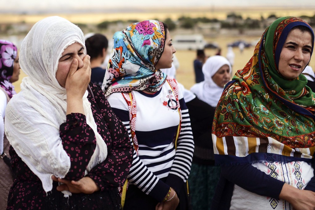 Syrian Kurdish women attend a gathering in support of the Syrian border town of Kobane in Suruc in Turkey's Sanliurfa province. Photo: AFP