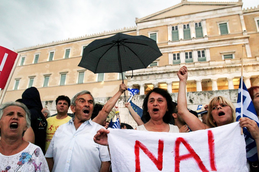 Greek protesters in favour of staying in the eurozone and the EU rally outside parliament in Athens on Tuesday. Photo: EPA