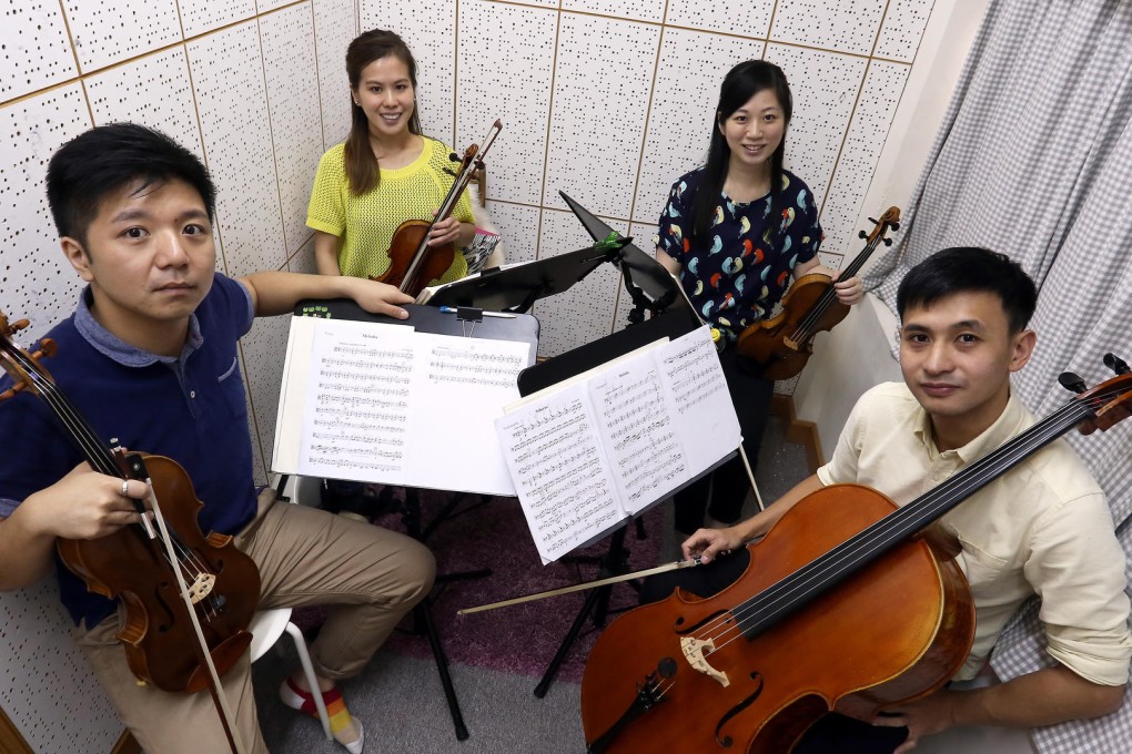 The Romer String Quartet's (from left) Ringo Chan, Kitty Cheung, Kiann Chow and Eric Yip at their Yau Ma Tei studio. Photo: Jonathan Wong