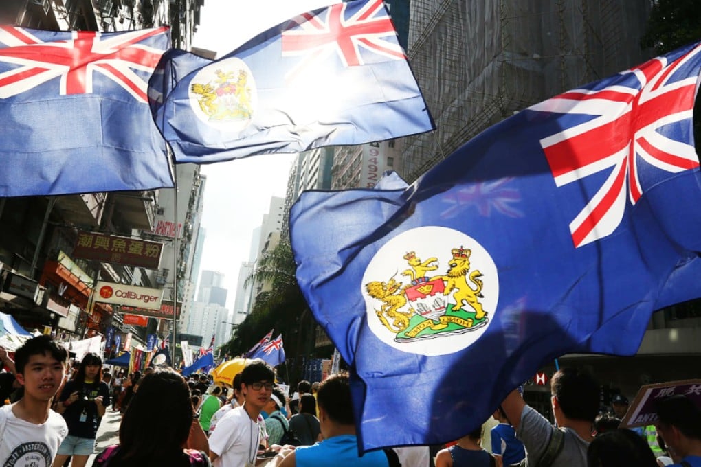 Colonial-era flags fly on the July 1 march, a symbol of calls for Hong Kong independence. Photo: Felix Wong