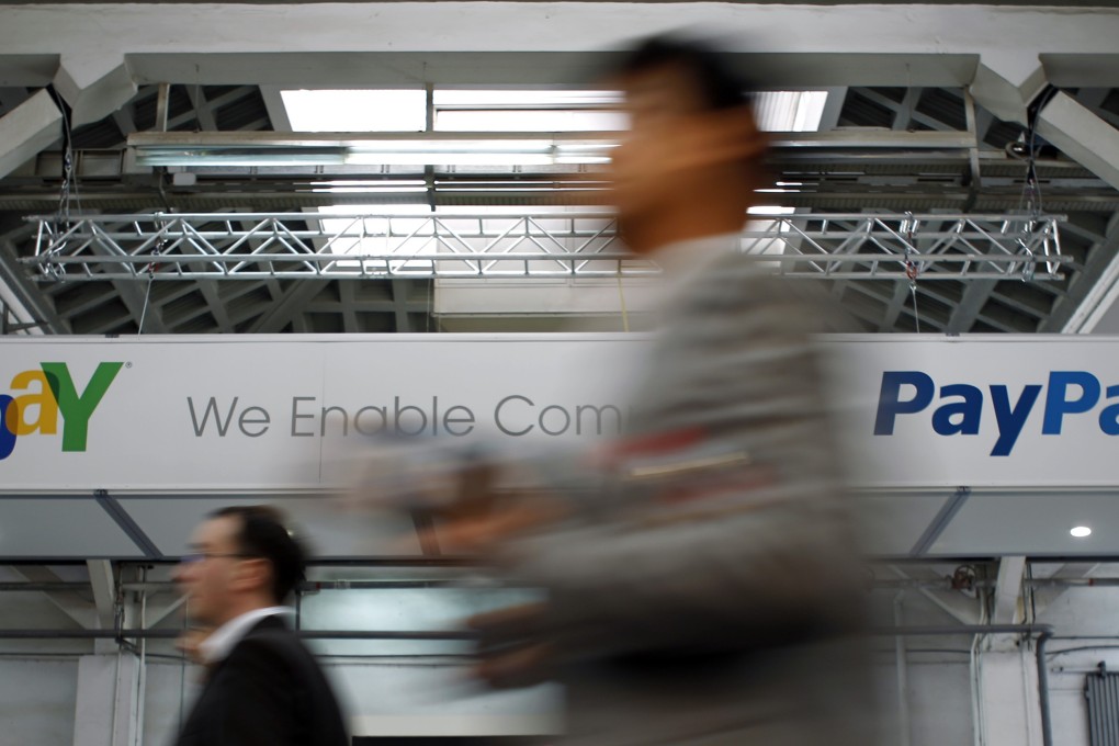 The logo of PayPal sits beside eBay, from which it is due to separate, as PayPal announced a deal to provide digital money provider Xoom. Photo: Reuters