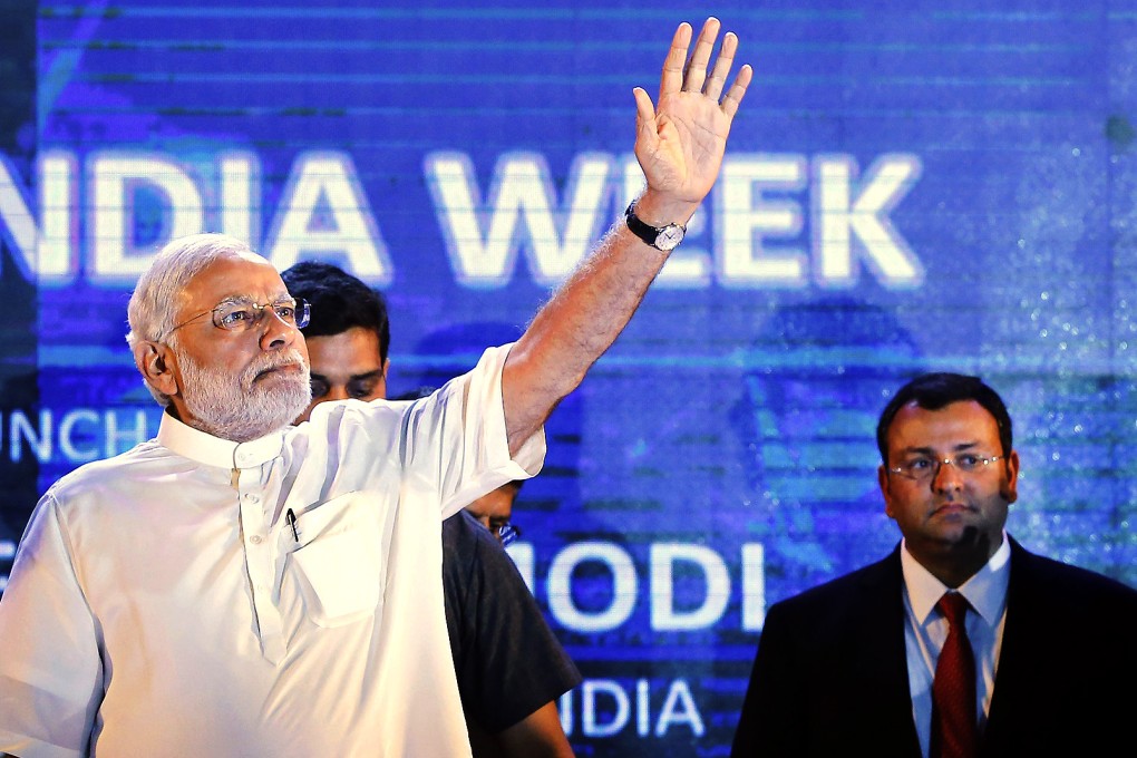 Indian prime minister Narendra Modi waves as Cyrus Mistry (right), chairman of Tata Group, watches during the launch of 'Digital India Week' in New Delhi on July 1, 2015. Photo: Reuters