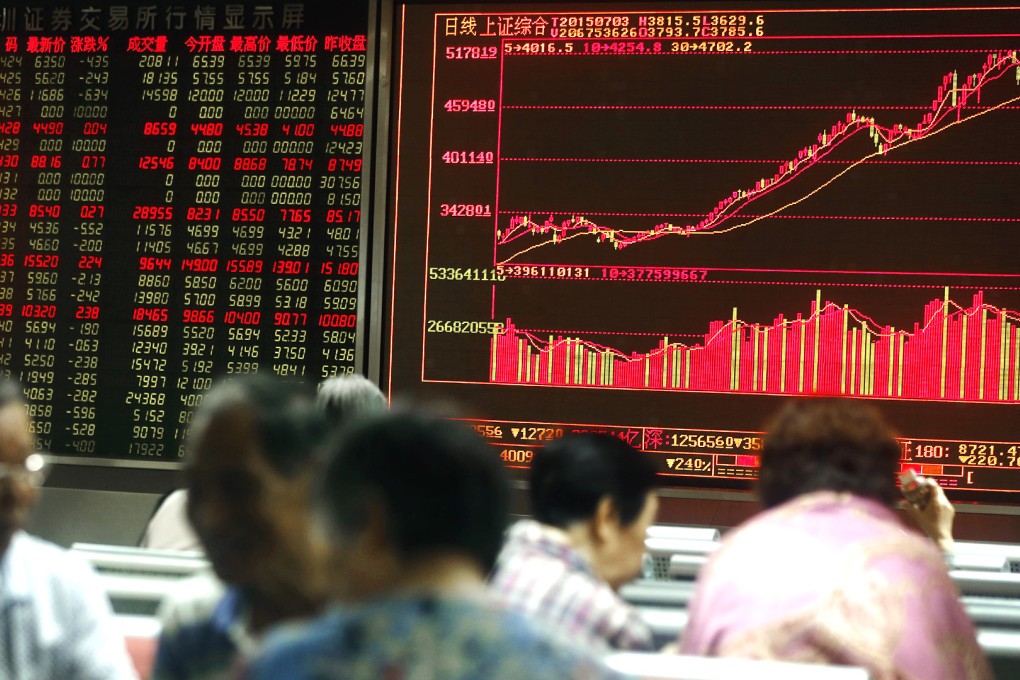 Chinese investors monitor stock prices in Shanghai, as shares opened lower on Friday in a rout from highs hit in the middle of June. Photo: EPA