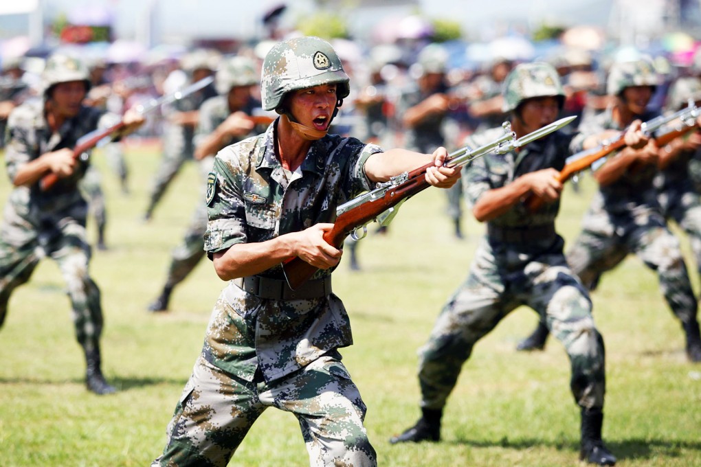China's Peoples' Liberation Army (PLA) soldiers perform a drill at the Ngong Shuen Chau Barracks in Hong Kong on July 1, 2015, to mark the 18th anniversary of Hong Kong's handover from Britain to China. Photo: AFP