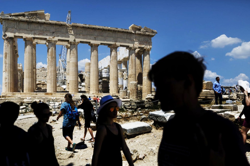 It's business as usual at tourist hotspots like the Acropolis. Photo: AP