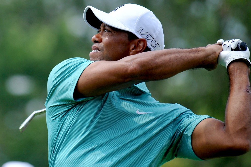 Tiger Woods tees off on the fourth hole during the first round of the Greenbrier Classic. Photo: AP
