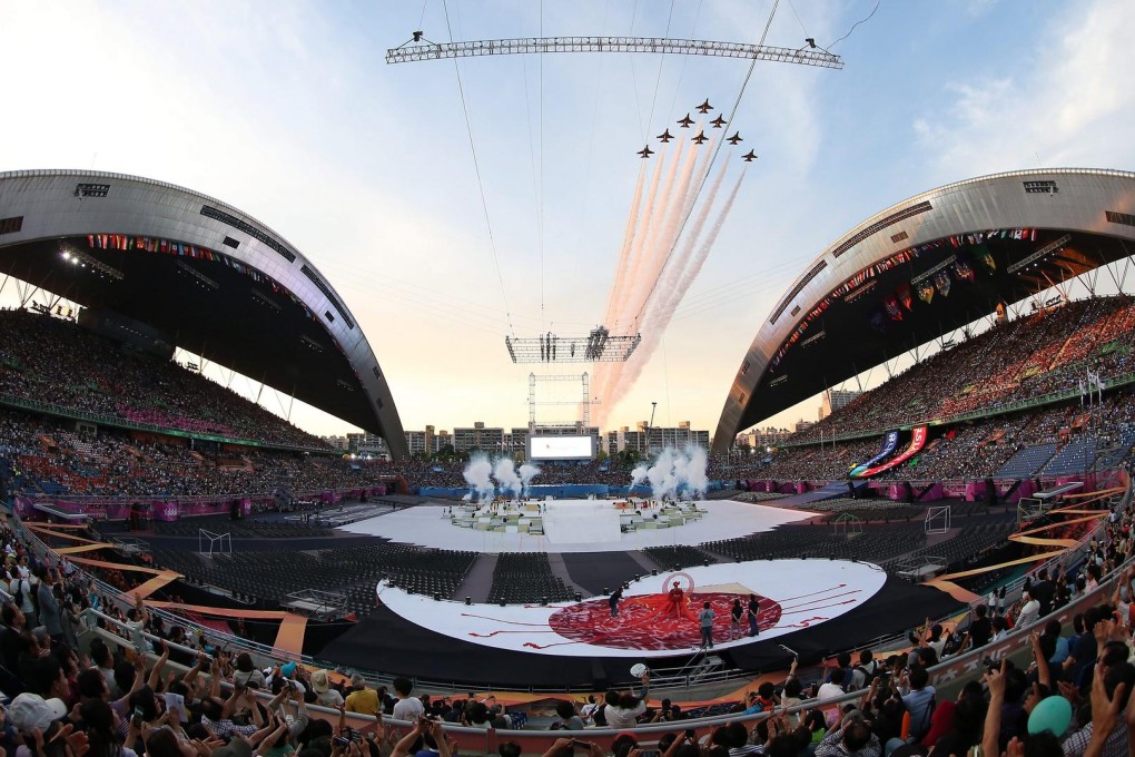 South Korea's military aerobatic team flies over the main stadium at the Universiade opening ceremony in Gwangju on Friday.Photo: EPA