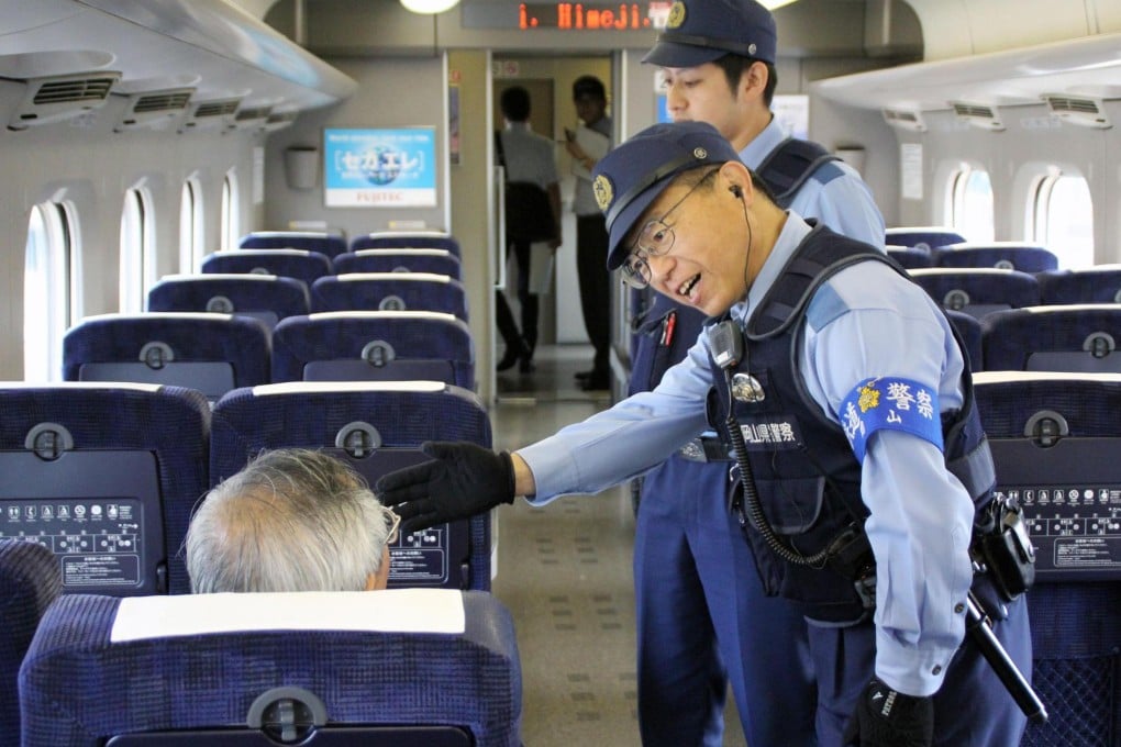 Police step up security on trains after the incident. Photo: Kyodo