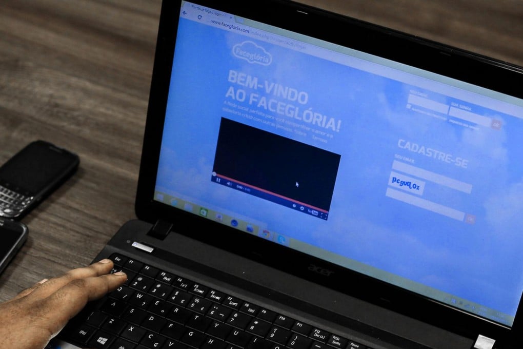 A user in Sao Paulo logs into Facegloria, in which an "Amen" button has replaced the "like" option.  Photo: AFP