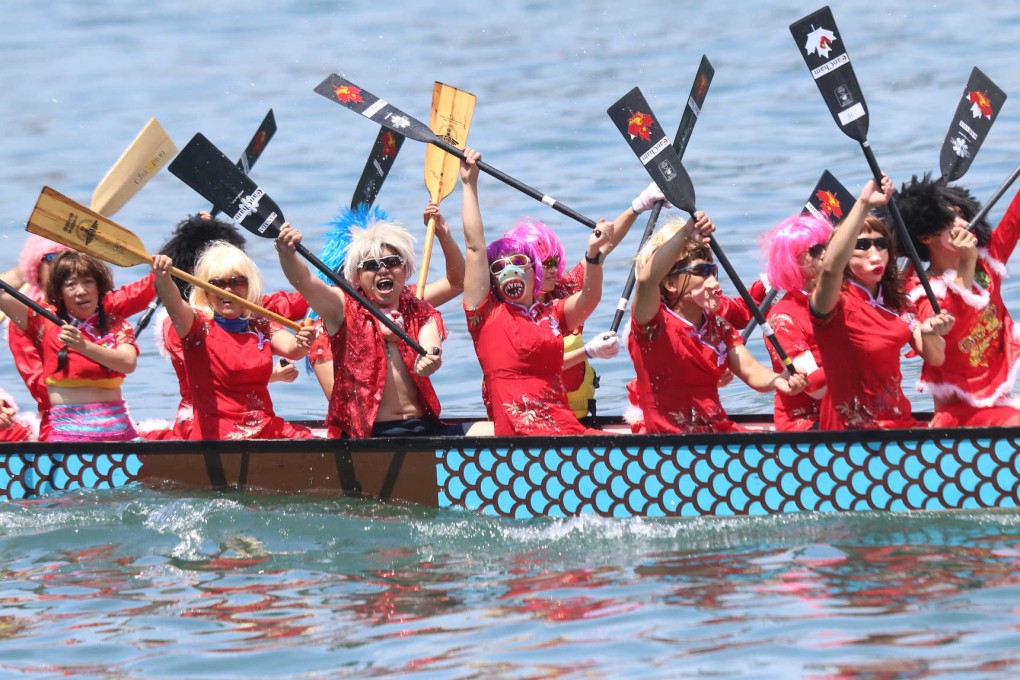 Having a hoot on the harbour: dragon boat racers come in funny constumes for the fancy dress competition. Photo: David Wong