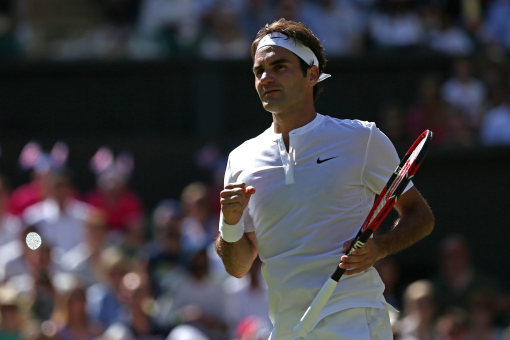 Roger Federer celebrates reaching the last 16 at Wimbledon after defeating Australia's Sam Groth. Photo: AFP