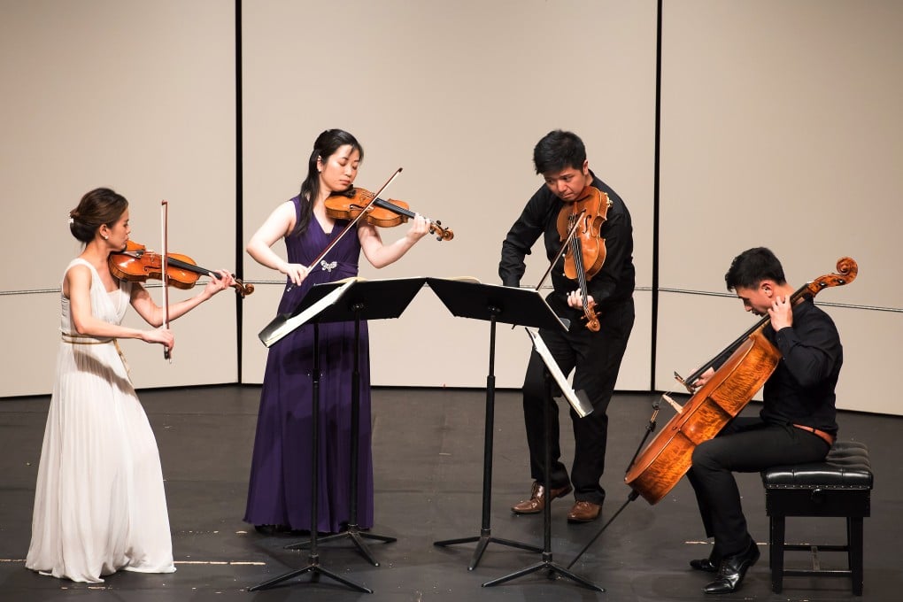 The Romer String Quartet performs at City Hall Theatre on July 3, 2015 as their first recital presented by the Leisure and Cultural Services Department since the four HK-born musicians formed the first homegrown string quartet in 2013. Photo: Kurt Chan