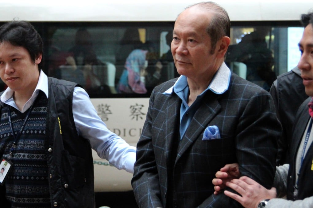 Alan Reginald John Ho (centre), nephew of Stanley Ho Hung-sun, was escorted to Macau's Procuratorate by Macao police in suspicion of manipulating prostitution in January. Photo: SMP Pictures