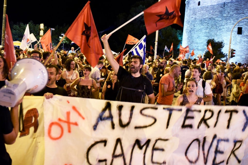 Supporters of the No vote celebrate after the results of the referendum in the northern Greek port city of Thessaloniki, Sunday, July 5, 2015. Greeks overwhelmingly rejected creditors’ demands for more austerity in return for rescue loans in a critical referendum Sunday, backing Prime Minister Alexis Tsipras, who insisted the vote would give him a stronger hand to reach a better deal. Photo: AP