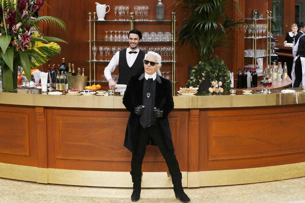 German designer Karl Lagerfeld appears at the end of his Autumn/Winter 2015/2016 women's ready-to-wear collection for French fashion house Chanel during Paris Fashion Week on March 10, 2015. Photo: Reuters