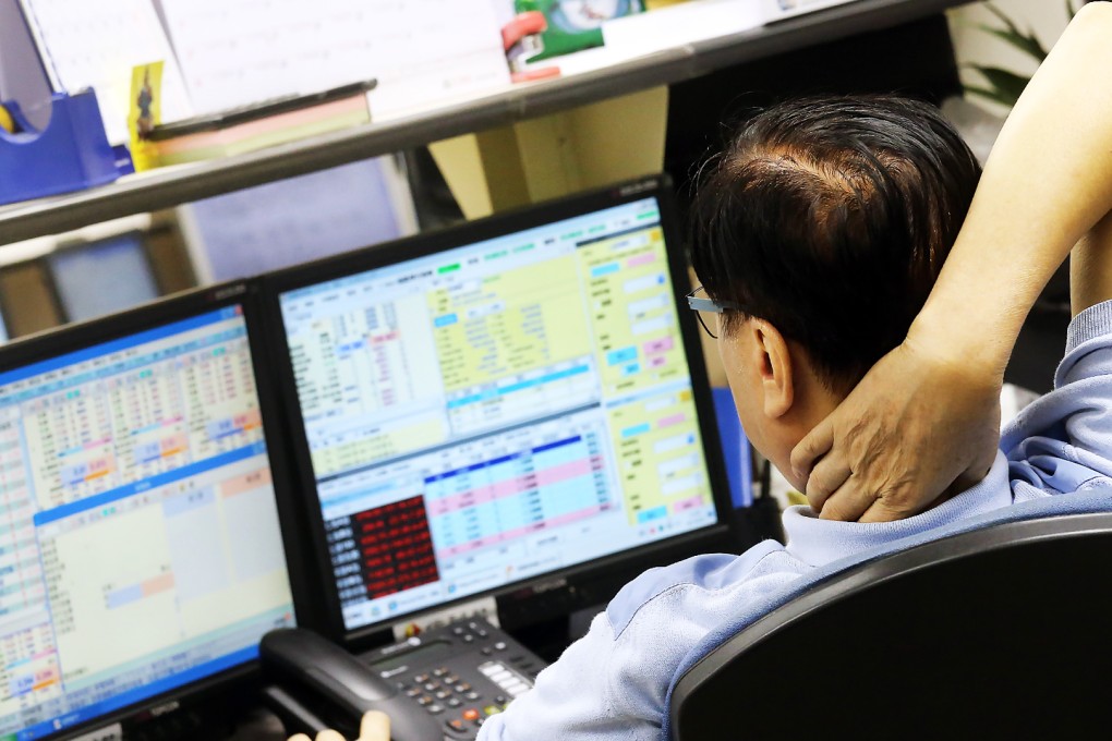 Investors dumped brokerage shares in a massive H-share selloff in Hong Kong . Photo: David Wong