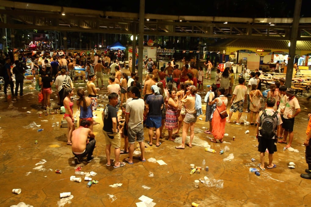 People gather on the open ground after a fire took place at a park in Taiwan. Photo: Xinhua