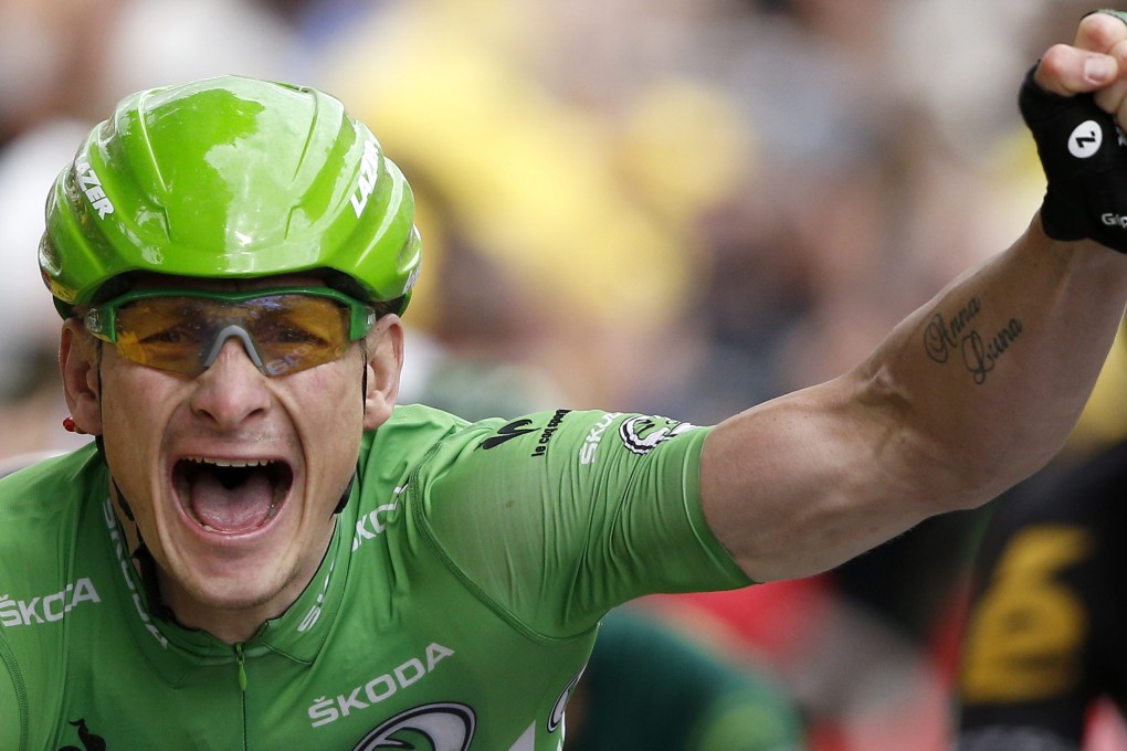 Andre Greipel of Germany celebrates as he crosses the finish line to win the fifth stage of the Tour de France. Photo: EPA