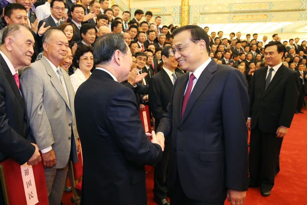 Premier Li Keqiang urged delegates to the first overseas Chinese industrial and commercial congress in Beijing on July 6 to contribute to the country's economic growth. Photo: Xinhua