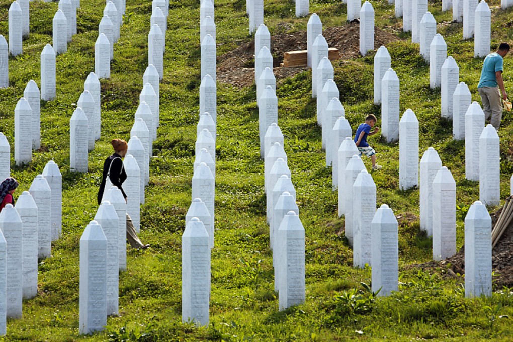 Bosnian people visit graves  at memorial center in Potocari near Srebrenica, 150 kms north east of Sarajevo, Bosnia on July 8,2015.  Photo: AP