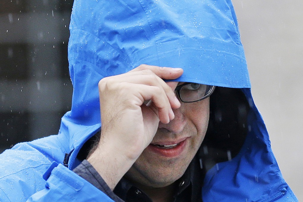 Subway restaurant spokesman Jared Fogle walks to a waiting car as he leaves his home on Tuesday in Zionsville, Indiana. Photo: AP