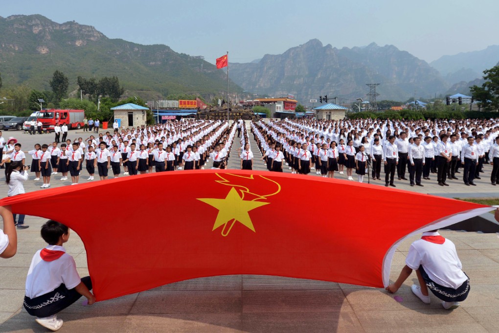People making a vow in front of the Museum of the War of the Chinese People's Resistance Against Japanese Aggression in Fangshan district in Beijing on July 7, 2015 as part of ceremonies marking the 78th anniversary of the start of the Sino-Japanese War. Photo: AFP