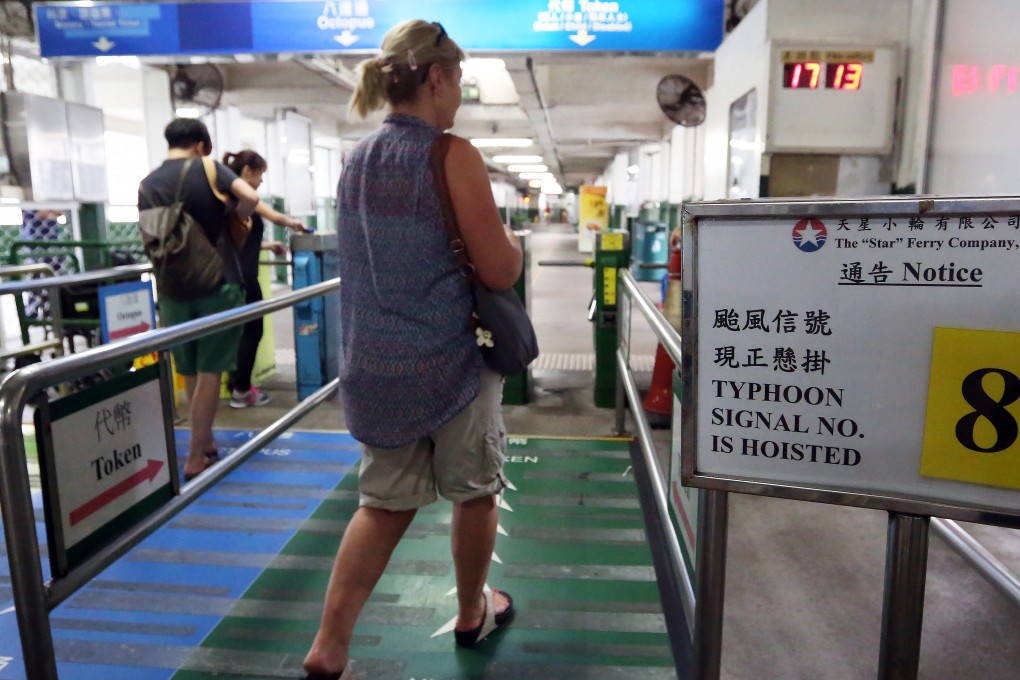 Residents rushed home as the Hong Kong observatory issued a T8 warning on Thursday, despite the lack of downpour or gale-force winds. Photo: Nora Tam