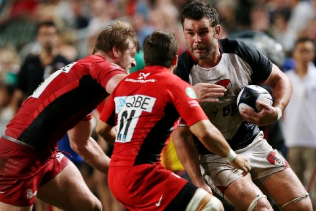 Nick Easter, playing for the Asia-Pacific Barbarians, charges the Saracens defence at Hong Kong Stadium in 2012. The veteran England number eight is one of five players cut Friday from Stuart Lancaster’s initial 50-man squad for the World Cup. Photo: Sam Tsang/SCMP