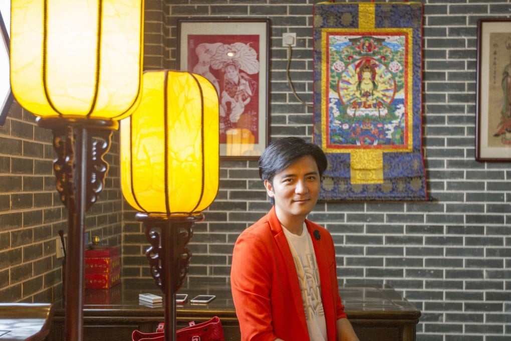 Feng shui master Li Jun suggests baby names by interpreting their birth time according to the five elements - metal, wood, water, fire and earth. Photo: Tan Qingju