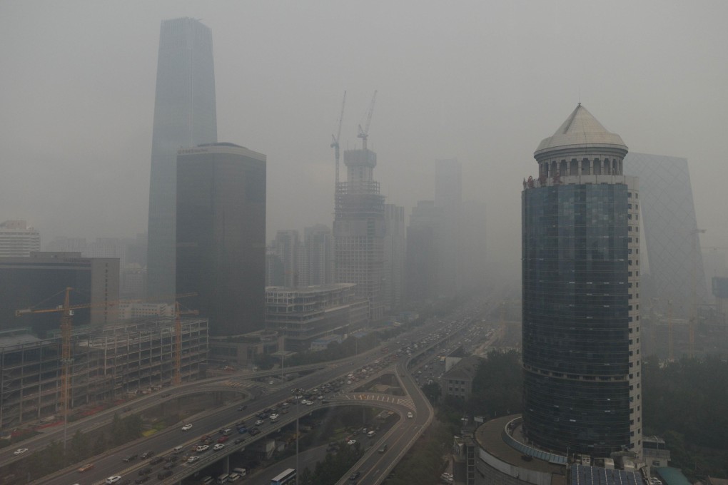 A choking smog envelops Beijing as bond markets could help China's pledge on climate change. Photo: Kyodo