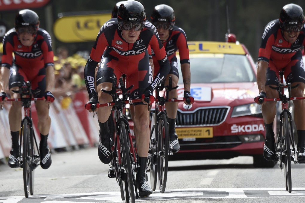 Riders of the USA's BMC Racing cycling team cross the finish line at the end of the 28 km team time-trial. Photo: AFP