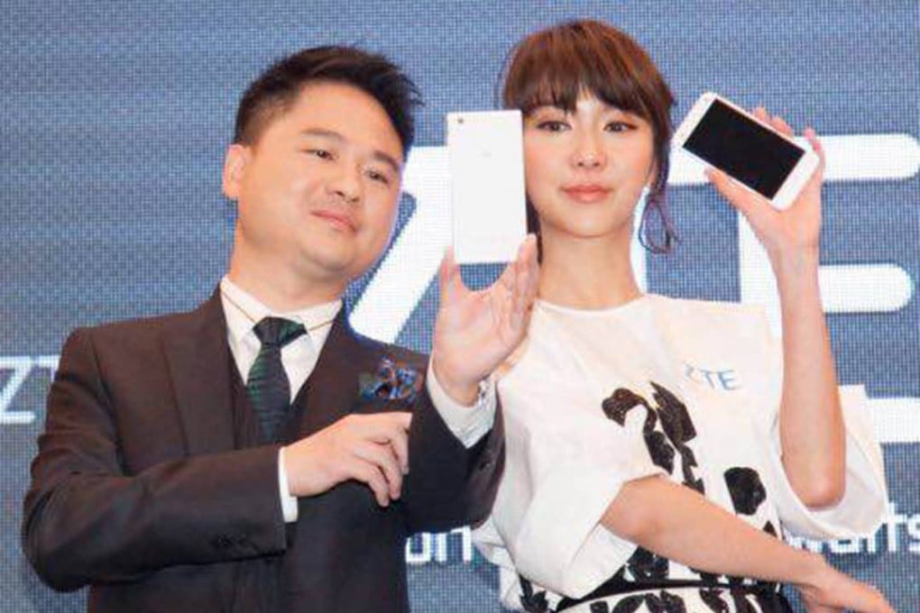 ZTE mobile devices chief executive Adam Zeng Xuezhong (left) said that the company shipped 26 million smartphones worldwide in the first half of 2015. Photo: SCMP Pictures
