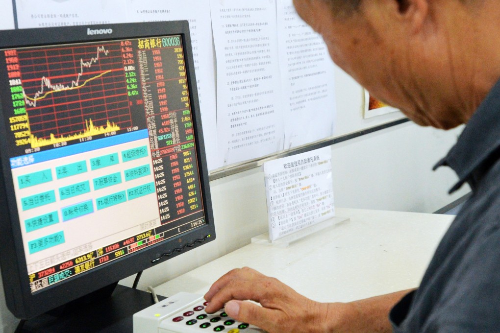 An investors in China looks at stocks to purchase as BNP Paribas said there are only 24 stocks worth buying in the Shanghai and Shenzhen stocks markets. Photo: Kyodo