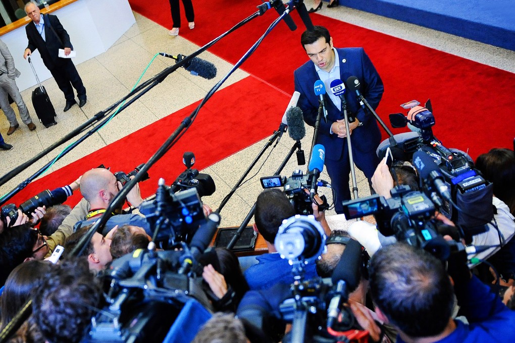 Greek Prime Minister Alexis Tsipras talks to the press at the end of the euro zone leaders summit on the Greek crisis, at the European Council headquarters in Brussels. Photo: EPA