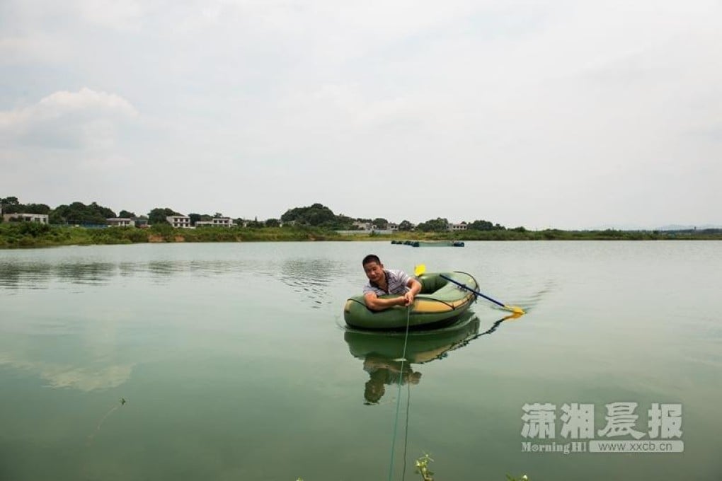 A boat in the water-filled foundations of Sky City in Changsha. Photo: Xxcb.cn