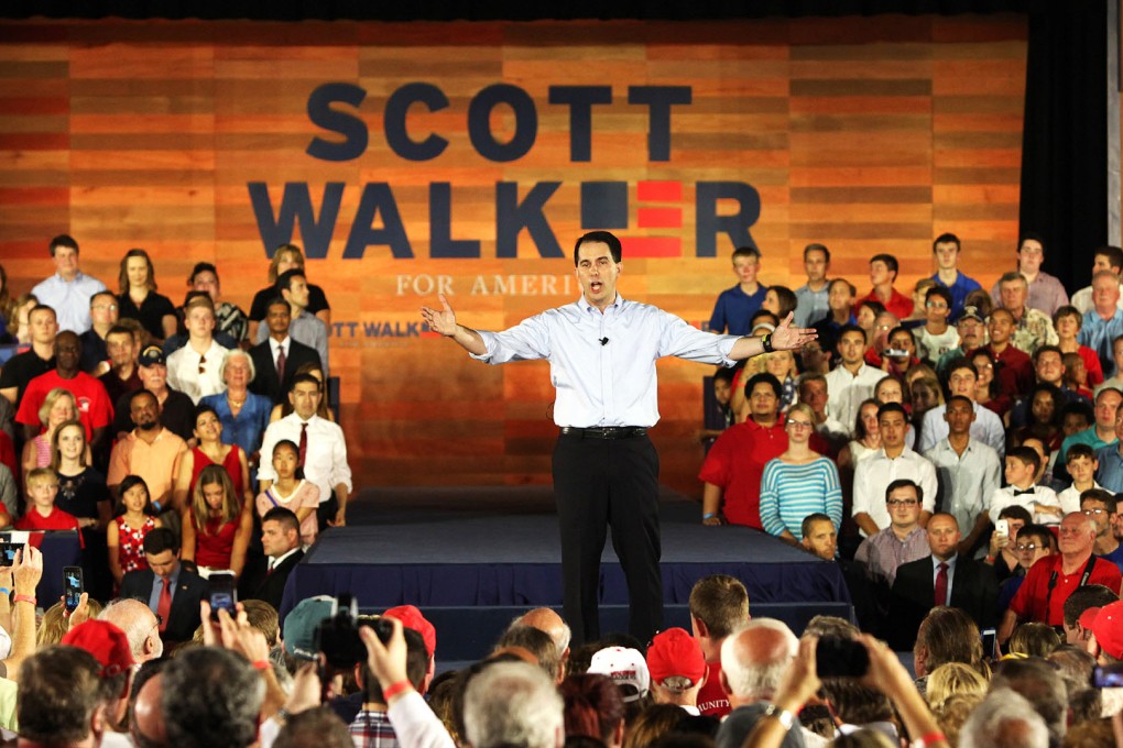 A worker sets up for the campaign kickoff rally for Wisconsin Governor Scott Walker, who was expected to promise to fight for the American people. Photo: TNS