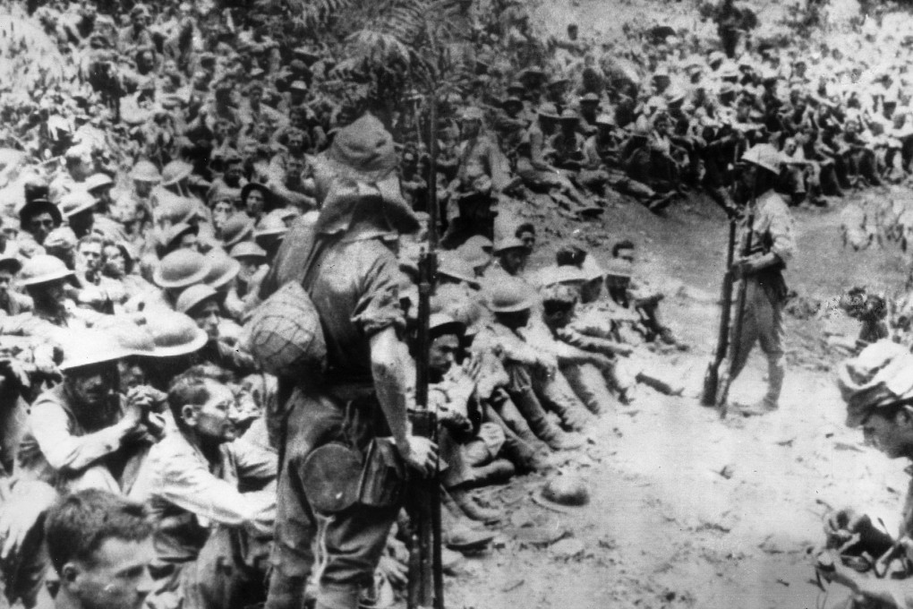 In this 1942 photo, Japanese soldiers stand guard over American war prisoners just before the start of the Bataan Death March following the Japanese occupation of the Philippines. Photo: AP
