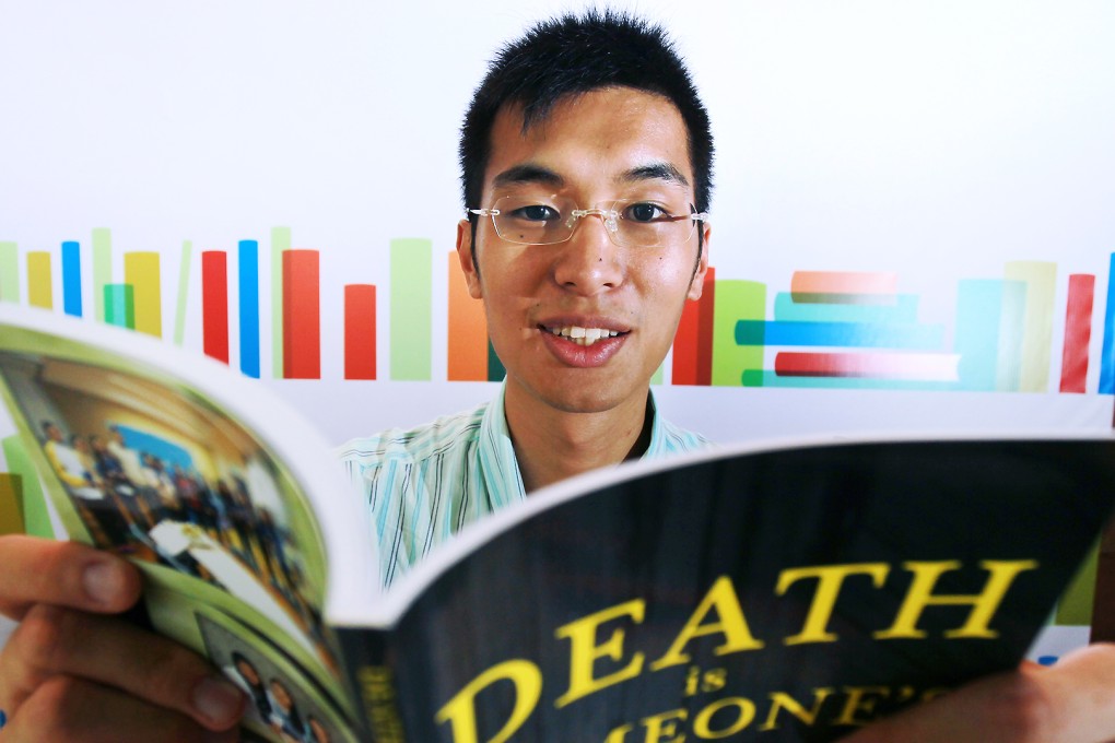 Adrian Ho with his latest book, which is available at the Hong Kong Book Fair. Photo: May Tse