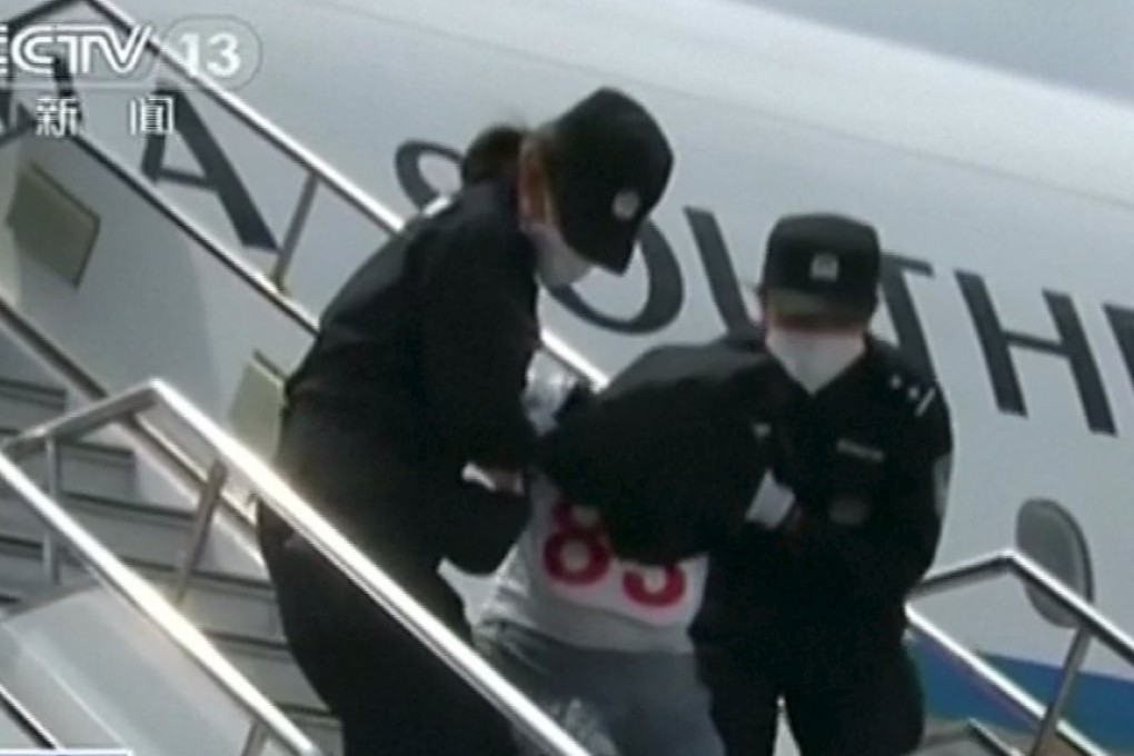 A still from CCTV footage purportedly of deportees from Thailand taken off an airplane by police at an unidentified location in China this month. Photo: Reuters