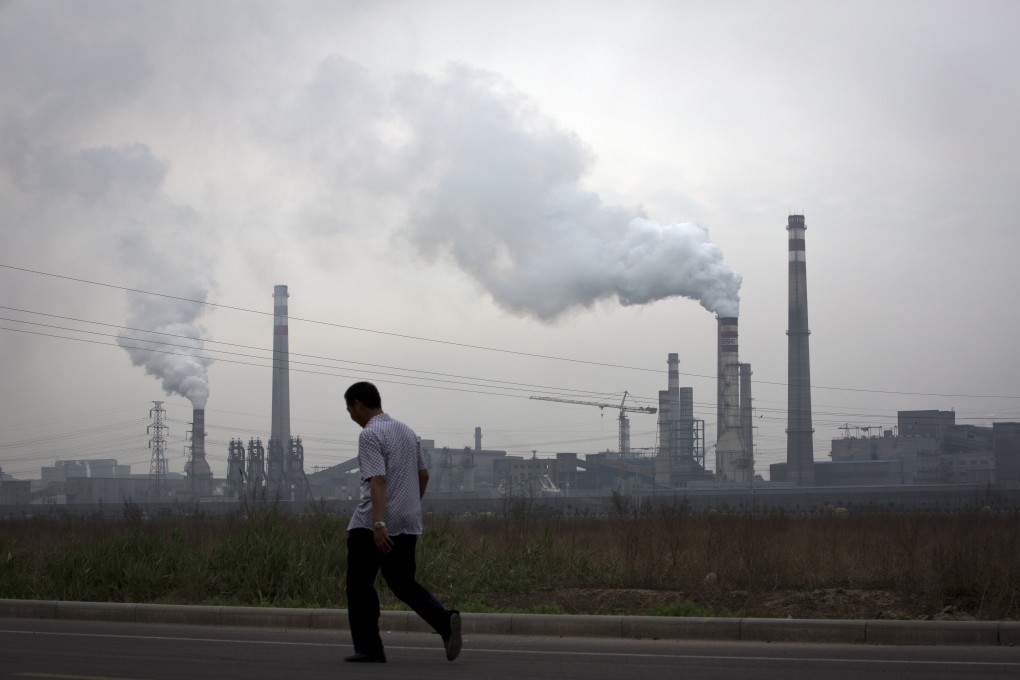 China's coal demand dipped this year but the fuel's widespread use in winter leaves huge areas blanketed in thick smog. Photo: AP