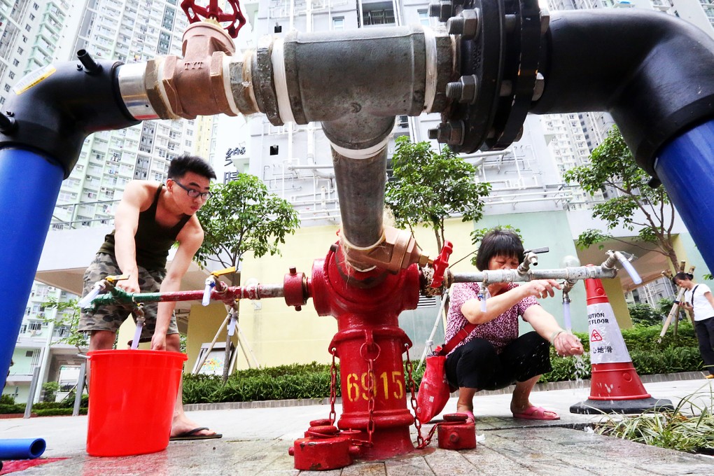 Residents of Kai Ching Estate use a temporary tap. Photo: Felix Wong