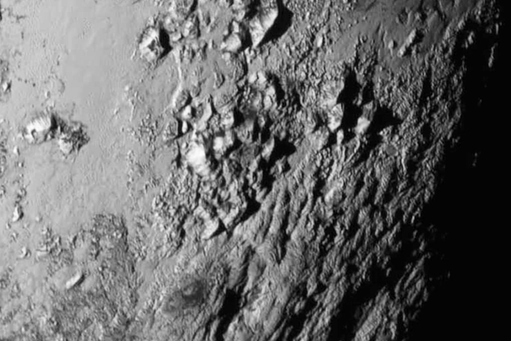 New close-up images of a region near Pluto's equator reveal a giant surprise - a range of youthful mountains rising as high as 11,000 feet (3,500 meters) above the surface of the icy body. Photo: NASA