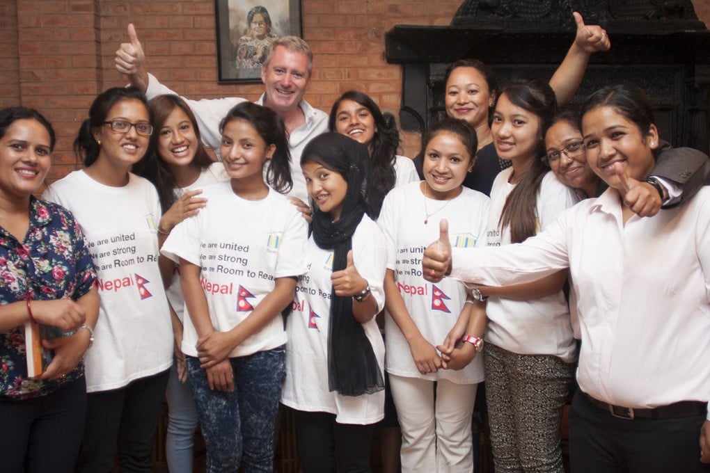 John Wood meets members of Room to Read's girls' education programme and Nepal office staff after his tour of quake-affected districts. Photo: Rishi Amatya/Room to Read