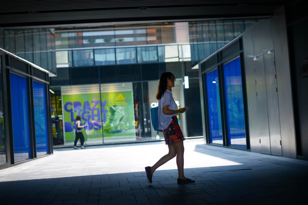 Shoppers in Beijing. Alibaba's scheme will fund smartphone apps that, for example, help people find deals in brick-and-mortar stores and pay for them using an app. Photo: AFP